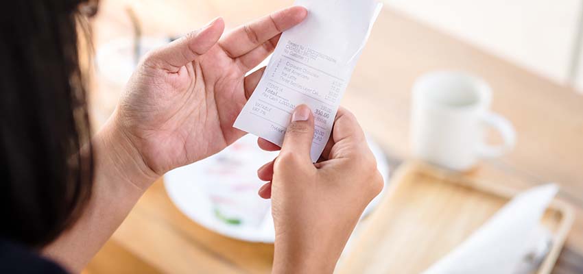 Woman holding a receipt