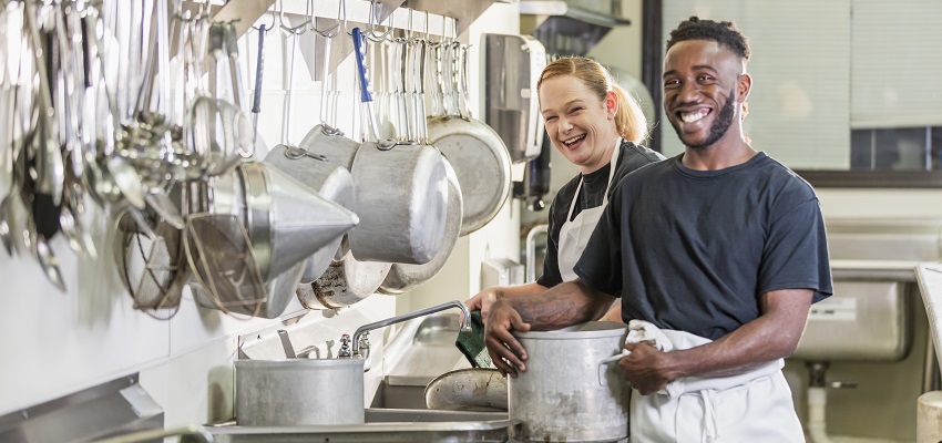 Two restaurant employees in the kitchen