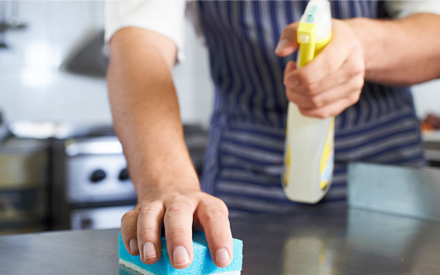 Chef wiping and disinfecting - Food Safety